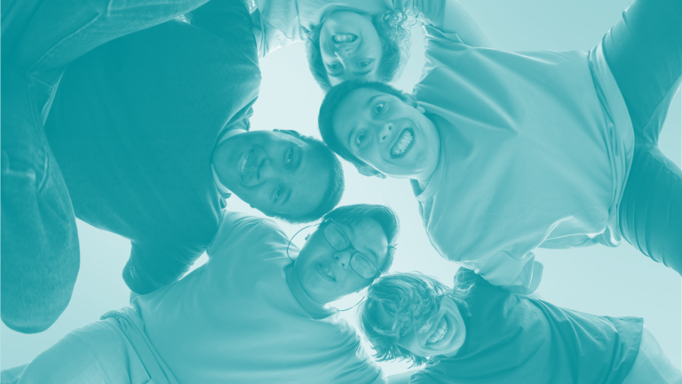 developmentally disabled people huddled in a group